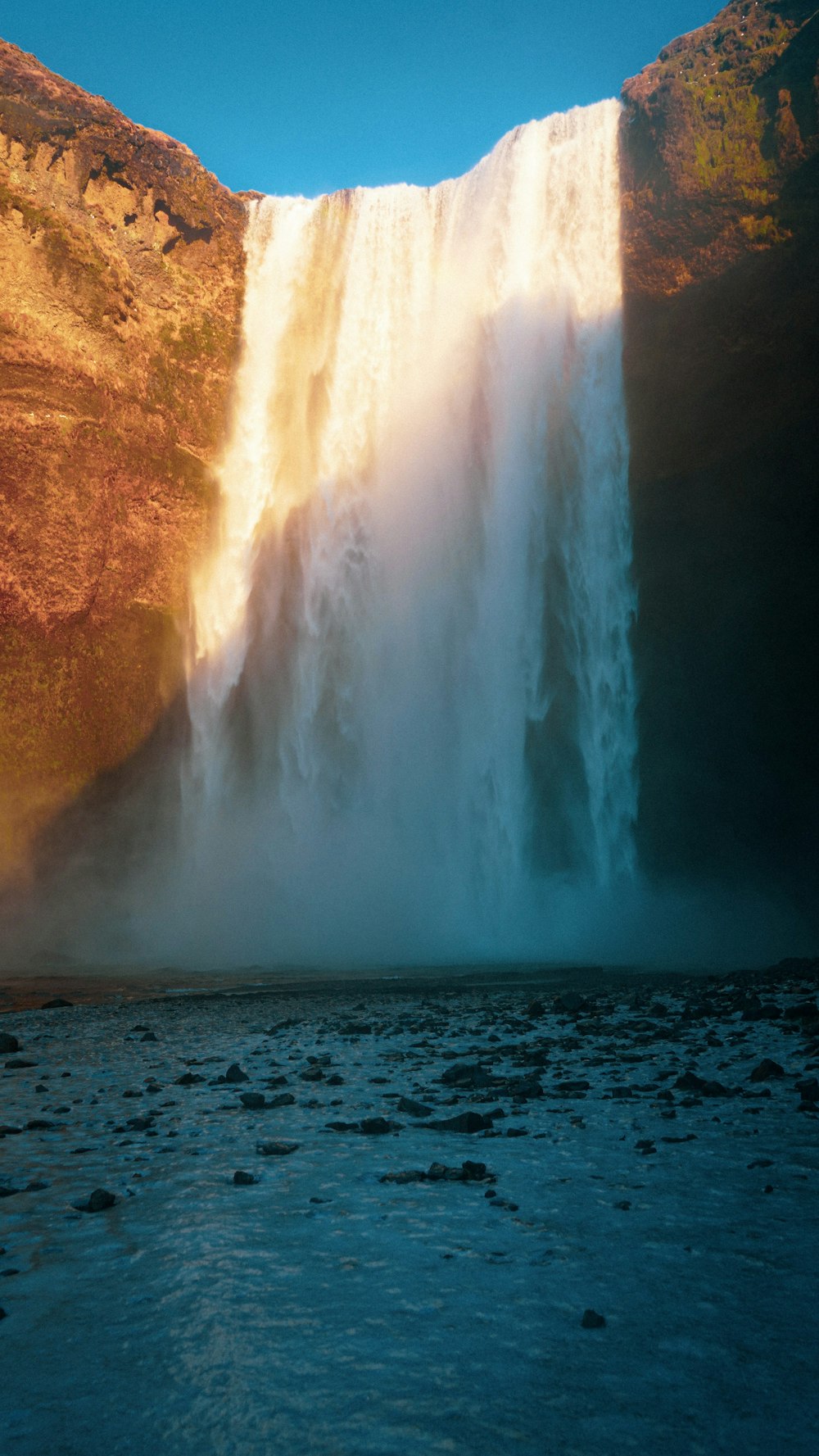 a large waterfall with water coming out of it