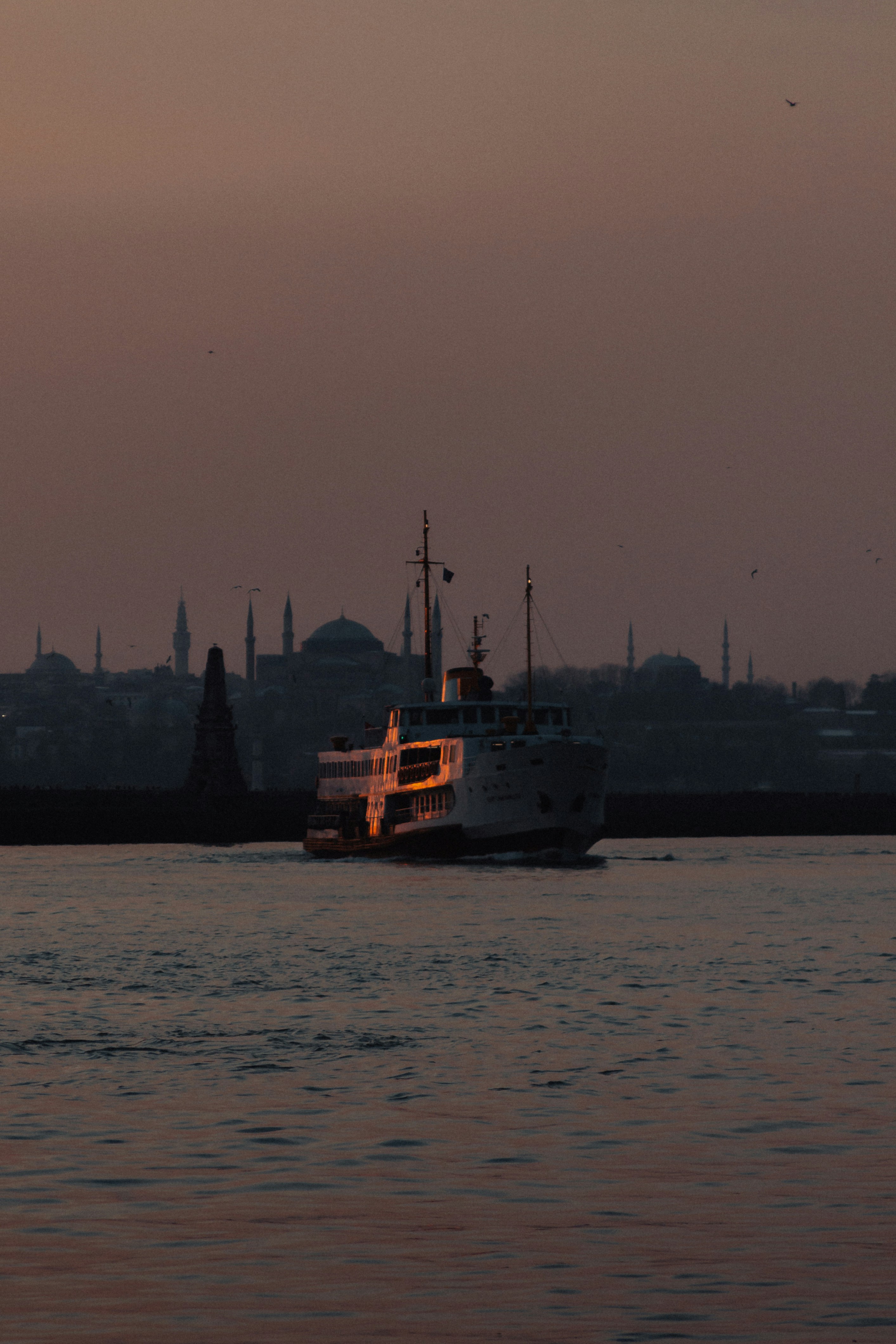 a large boat floating on top of a body of water