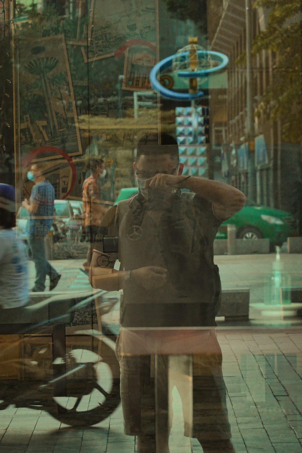 a man standing in front of a store window