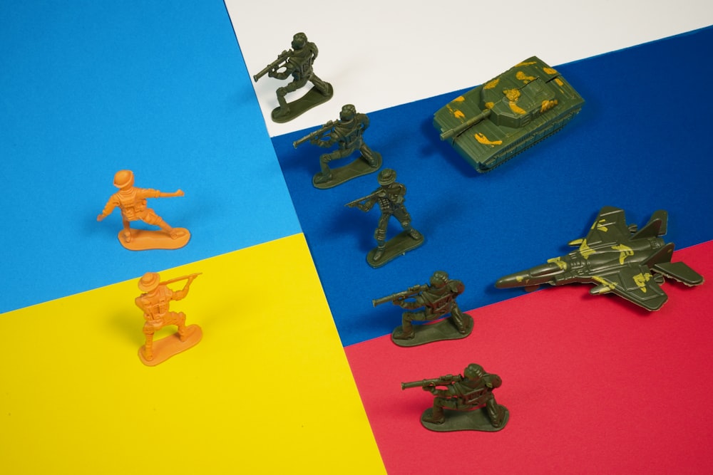 a group of toy army figures sitting on top of a table