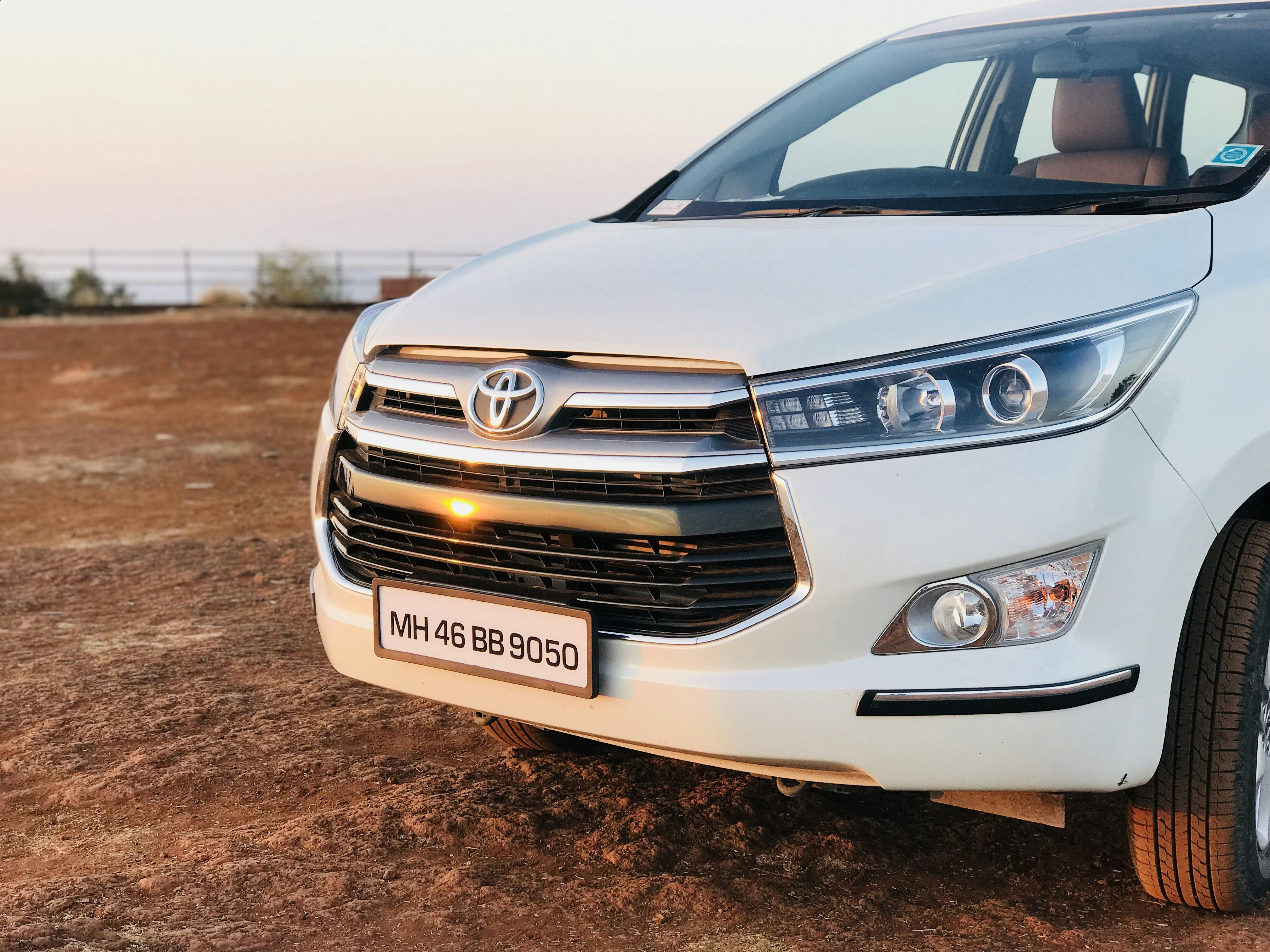 Toyota Innova premium MPV in white color for comfortable travel
