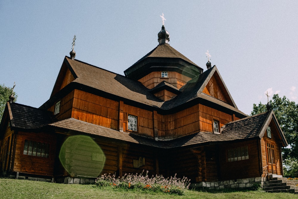 a large wooden building with a steeple on top of it