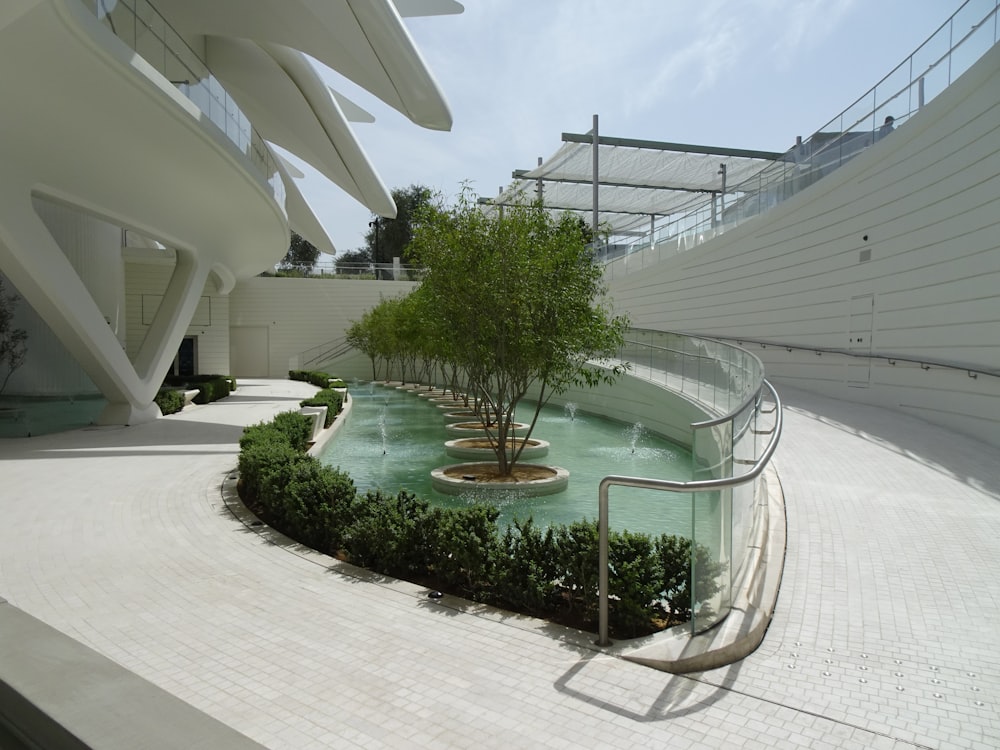 a building with a pool of water in the middle of it