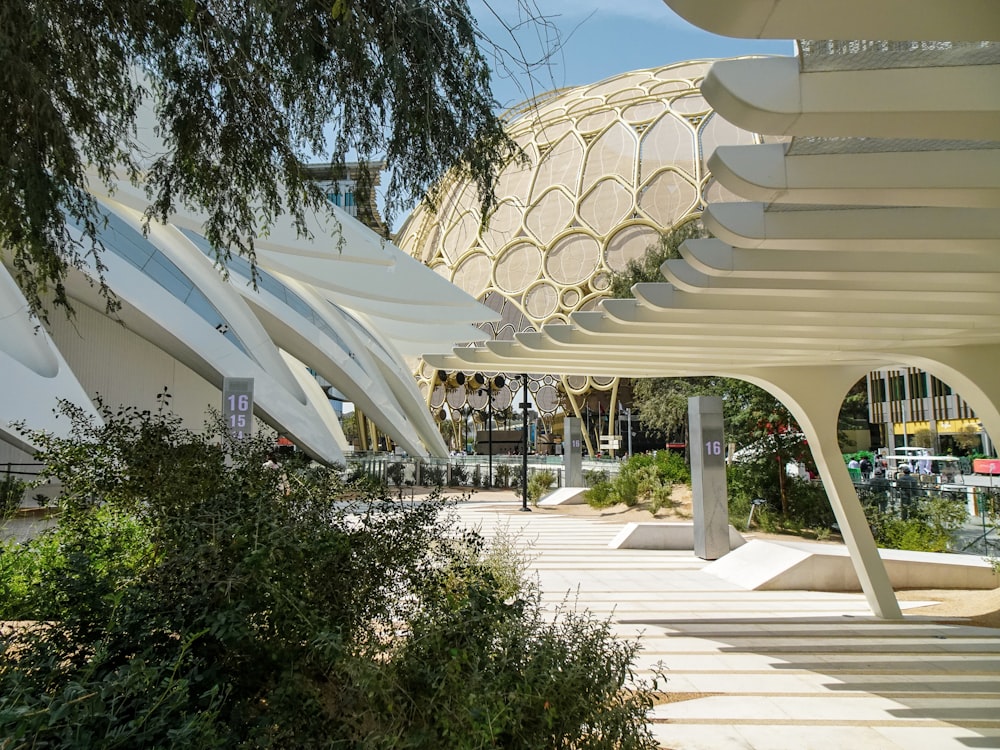 a large white building with a canopy over it