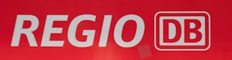 White lettering spells out 'REGIO' followed by a logo with the letters 'DB' inside a red rectangle with a white outline.