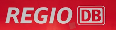 White lettering spells out 'REGIO' followed by a logo with the letters 'DB' inside a red rectangle with a white outline.