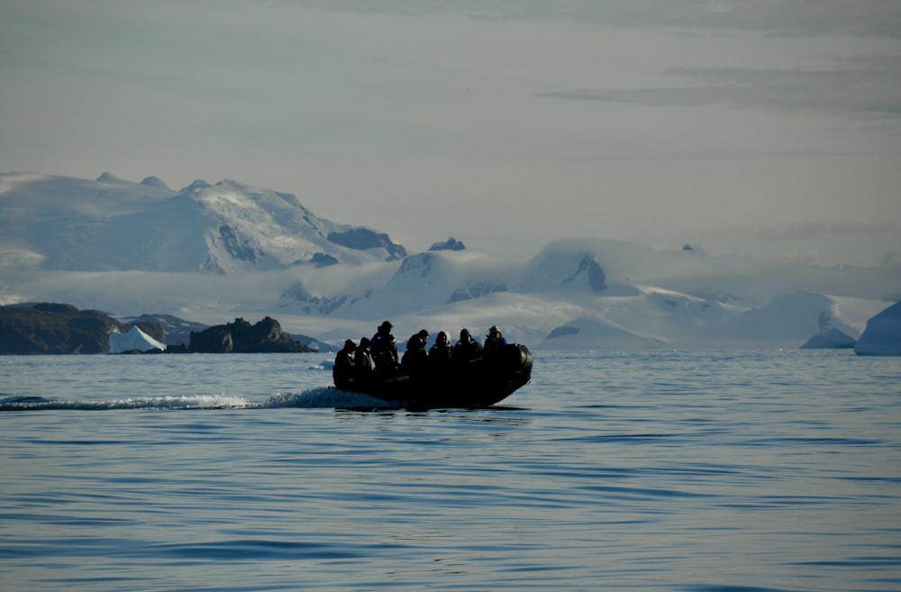 a group of people on a boat in the water