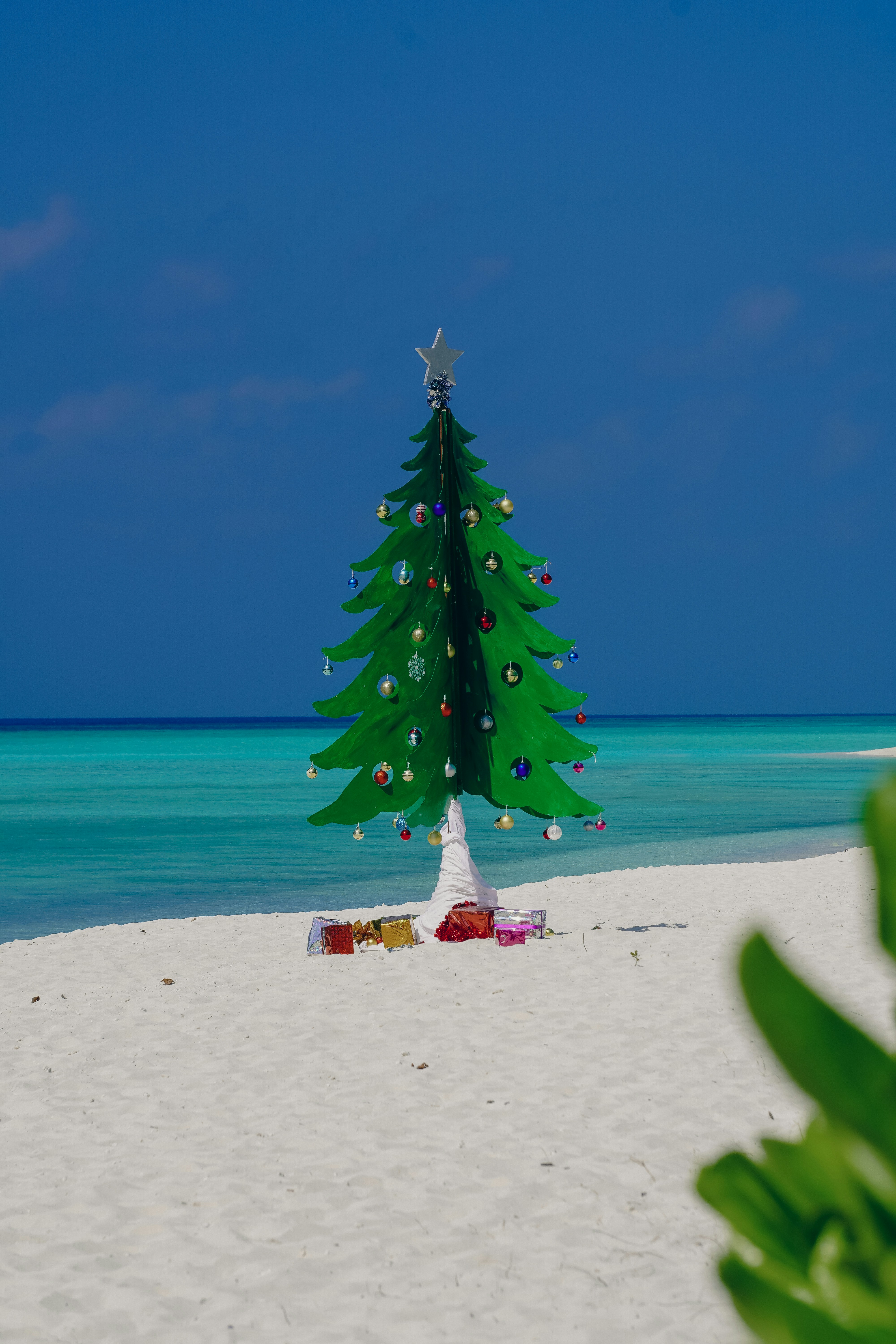 an umbrella sitting on top of a sandy beach