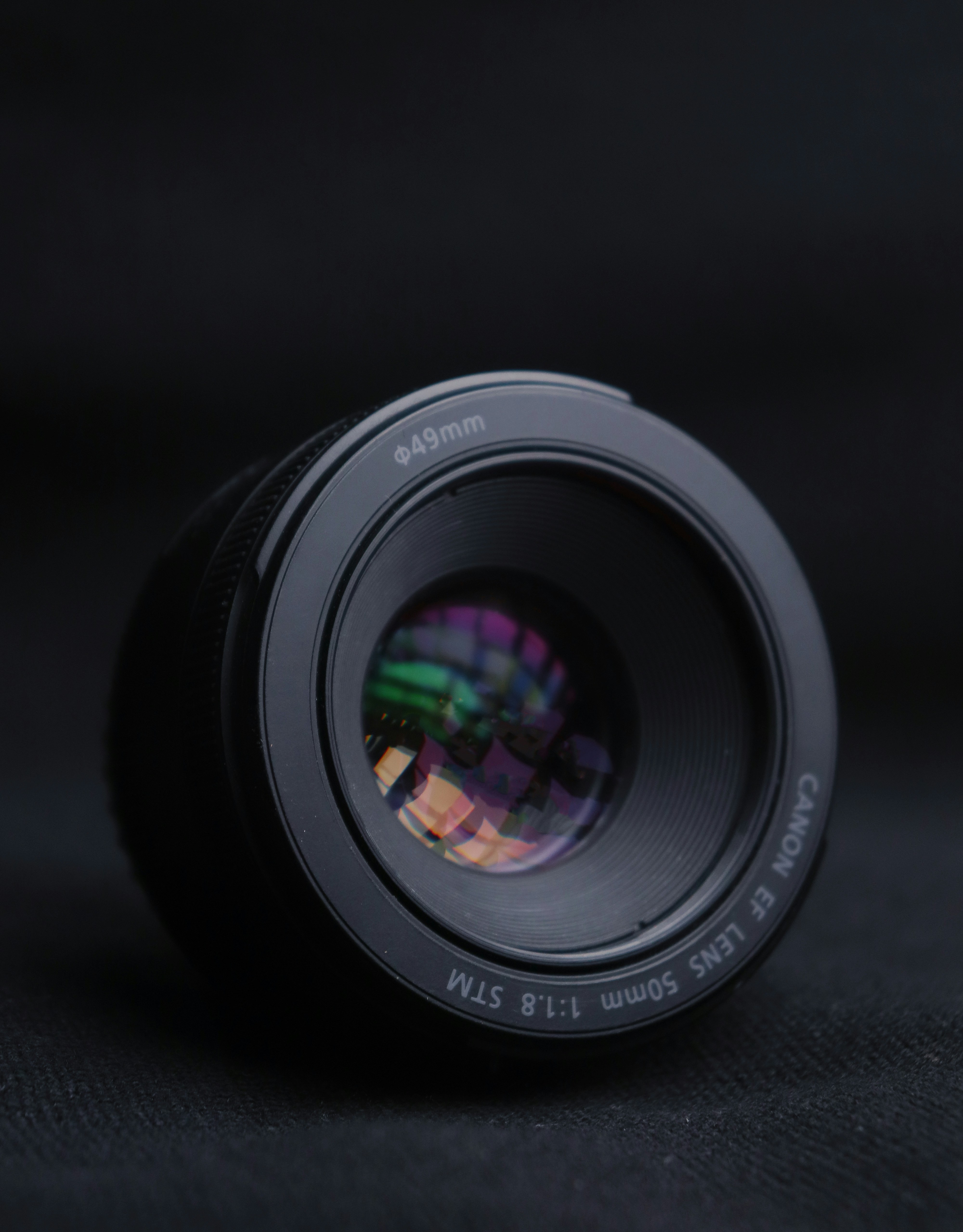 a close up of a camera lens on a black surface