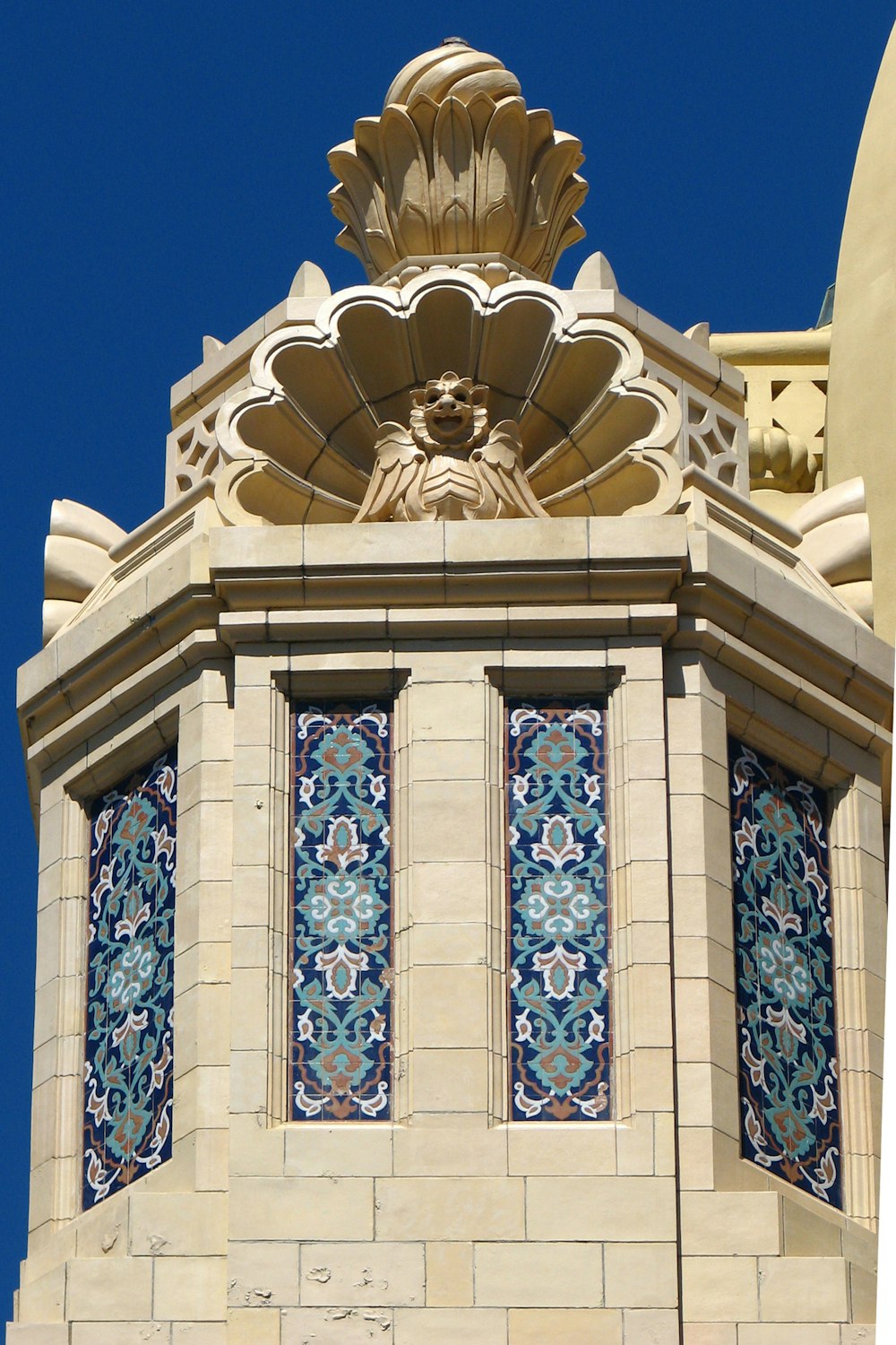 a clock tower with a blue sky in the background