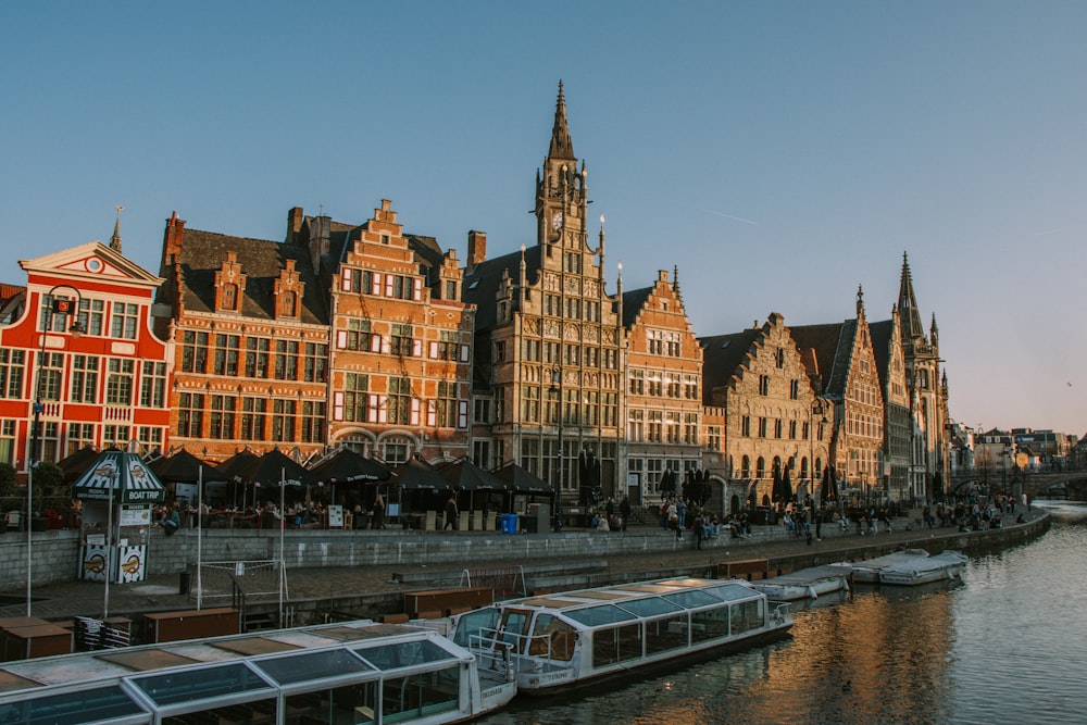 a row of buildings next to a body of water