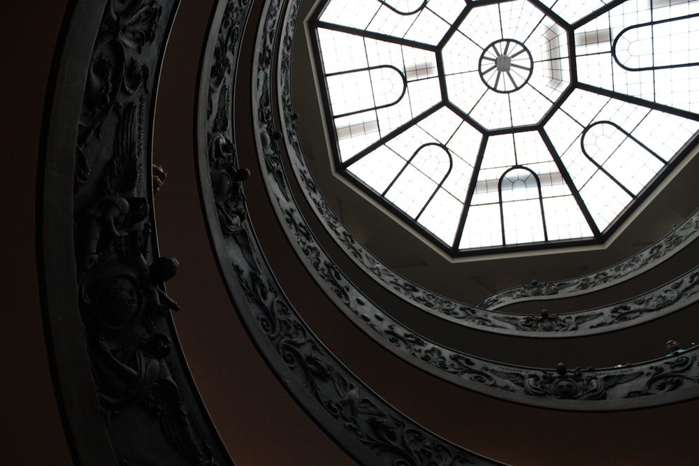 a circular window in a building with a skylight