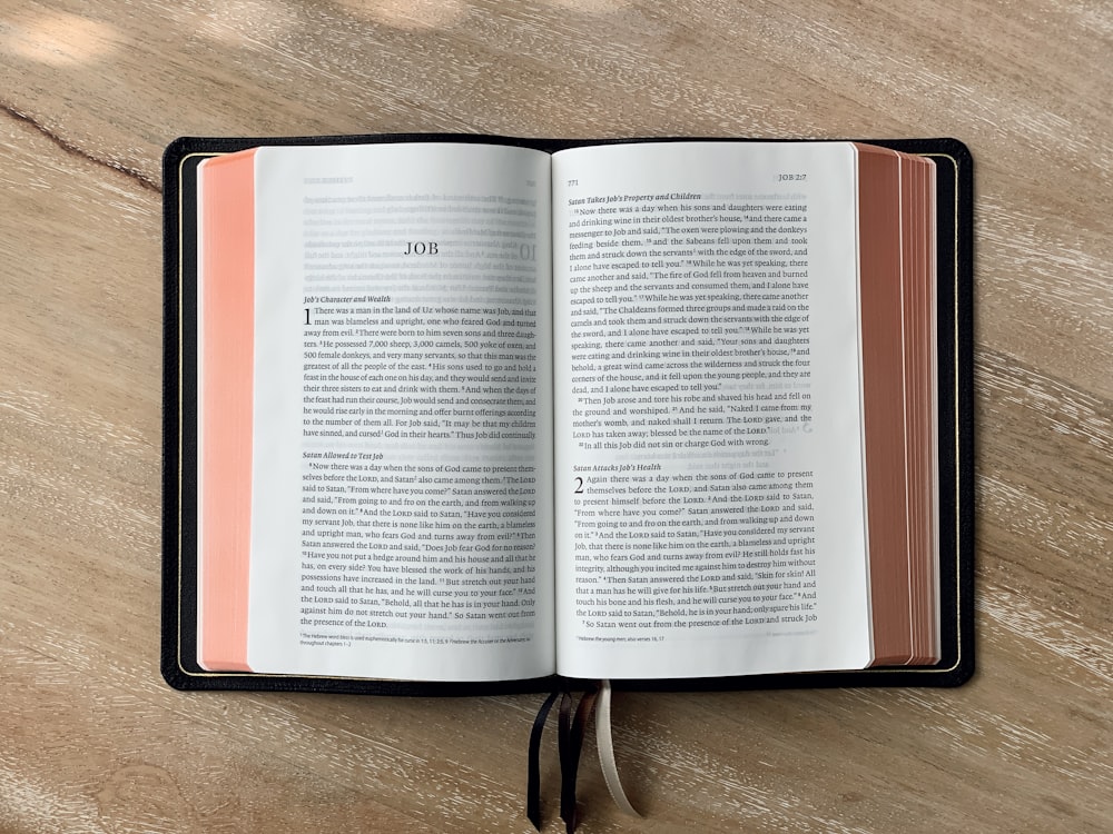 an open book sitting on top of a wooden table