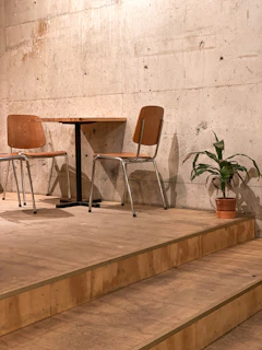 a couple of chairs sitting on top of a set of steps