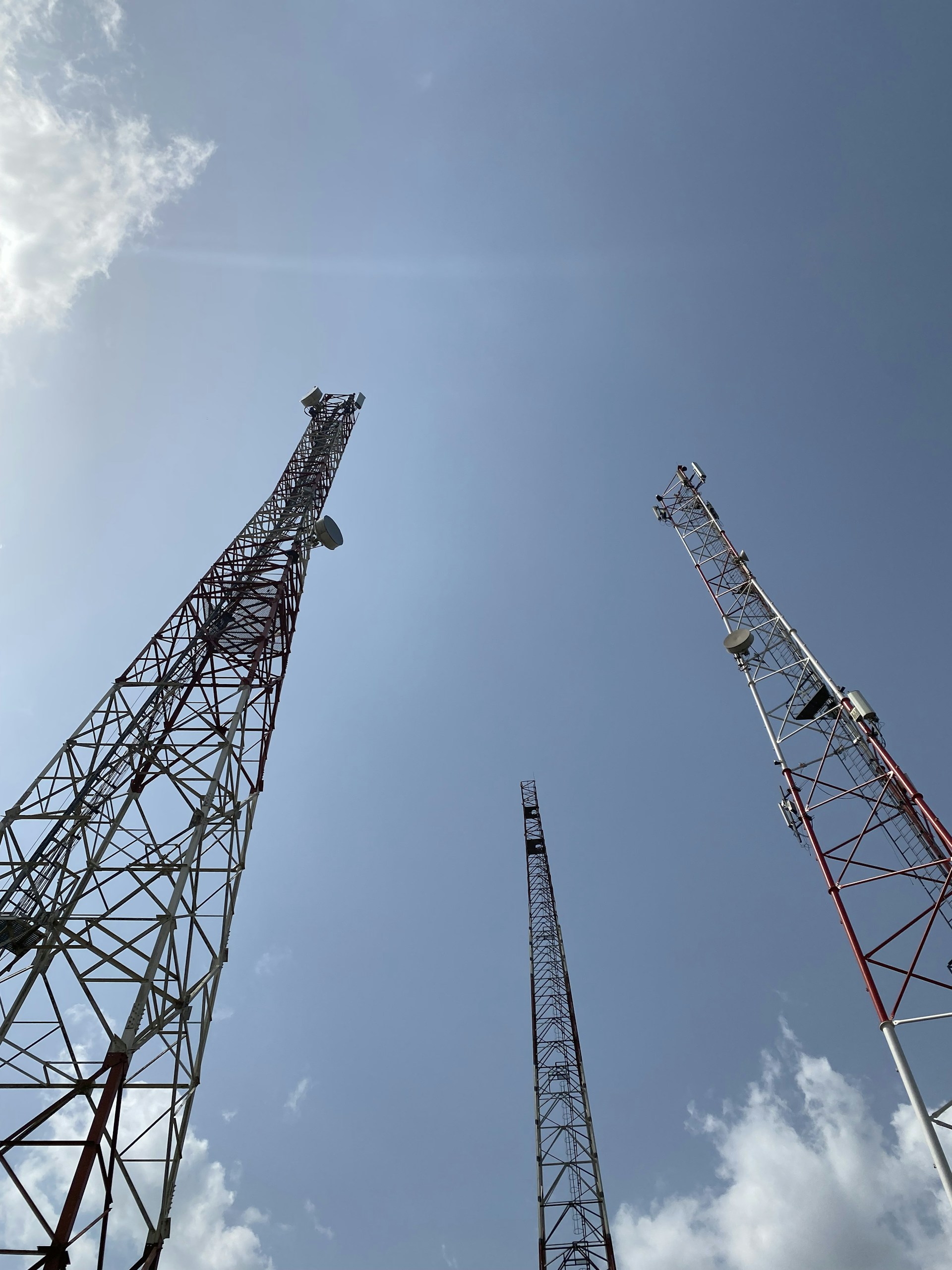 woman wearing yellow long-sleeved dress under white clouds and blue sky during daytime