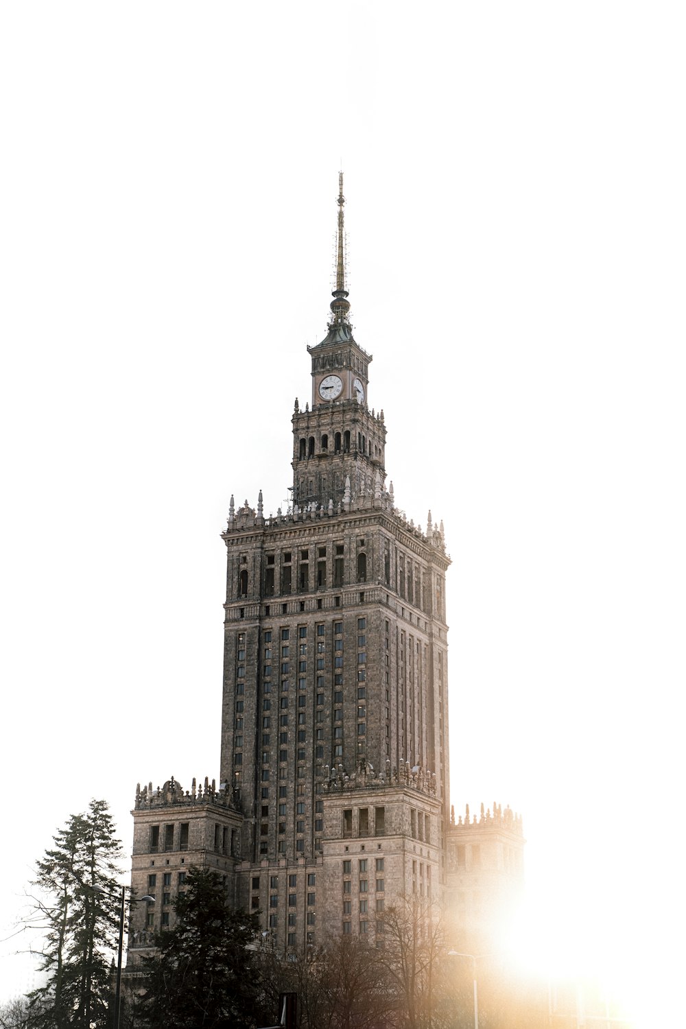 a tall building with a clock on the top of it