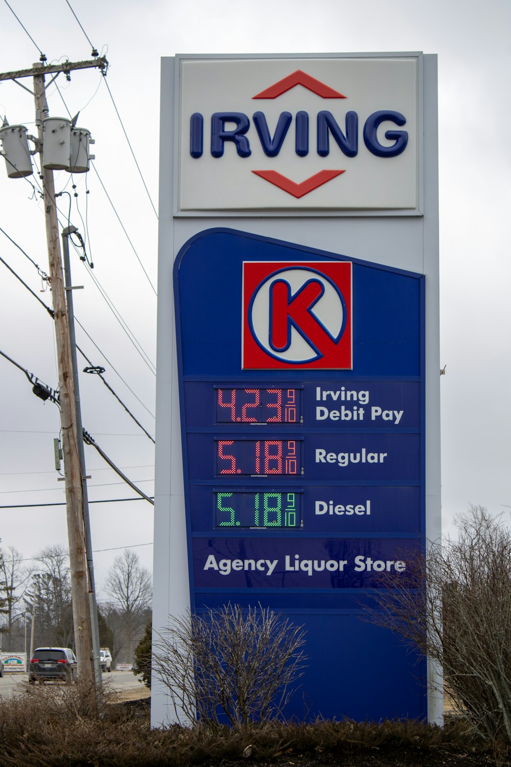 a blue and white sign for a gas station