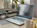 A sleek workspace with a laptop, coffee cup, and natural fruit accents reflecting a modern boutique agency vibe.