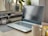 A modern workspace with a laptop, notepad, and coffee, symbolizing productivity and creativity.