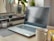 A modern workspace with a laptop, notepad, and coffee, symbolizing productivity and creativity.