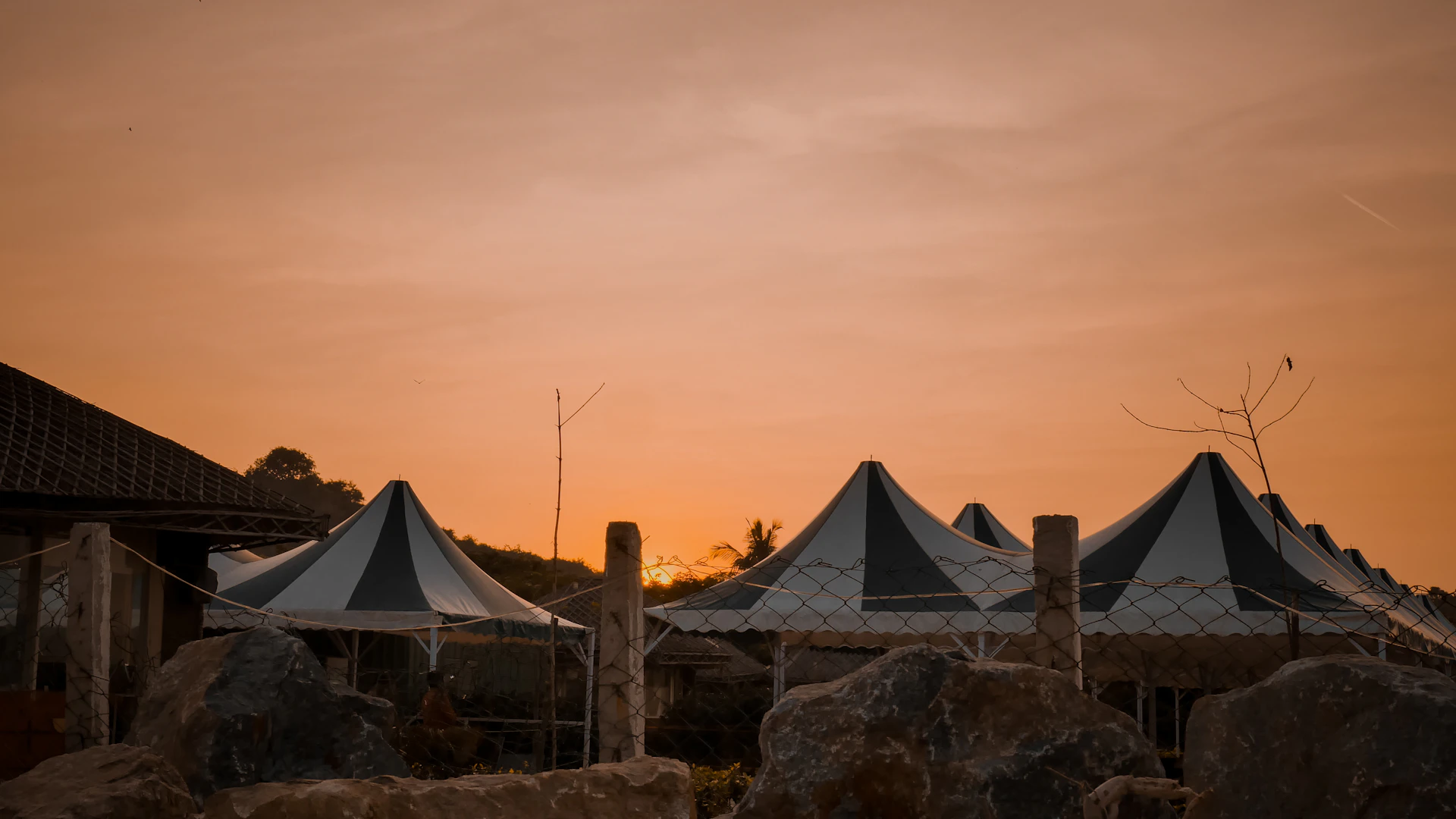 woman wearing yellow long-sleeved dress under white clouds and blue sky during daytime