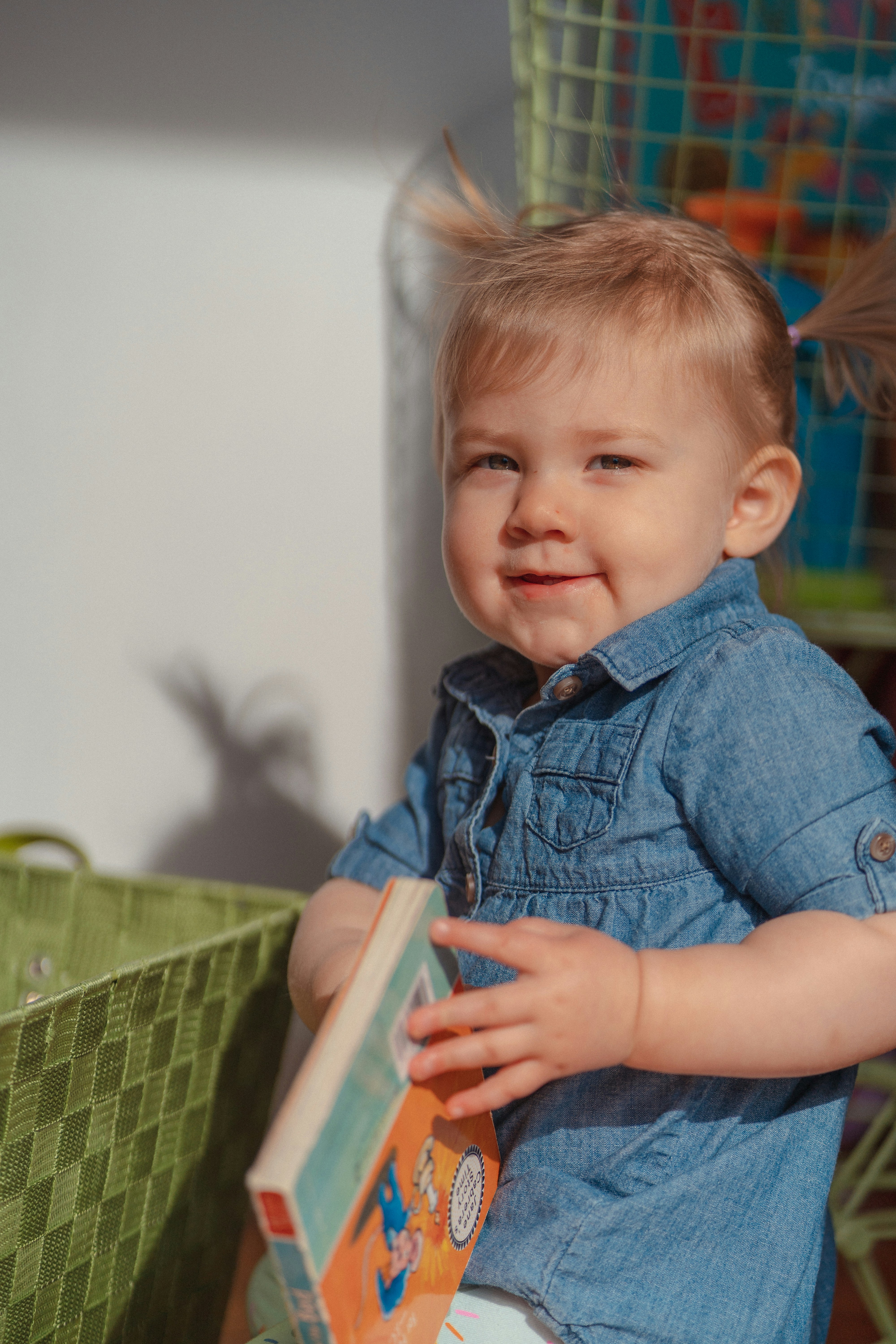a little boy that is holding a book