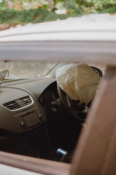 a car with a paper bag in the passenger seat