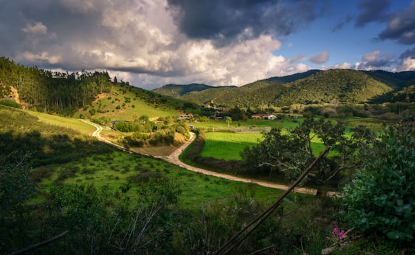 Lush green valley surrounded by volcanic mountains on São Miguel island in the Azores