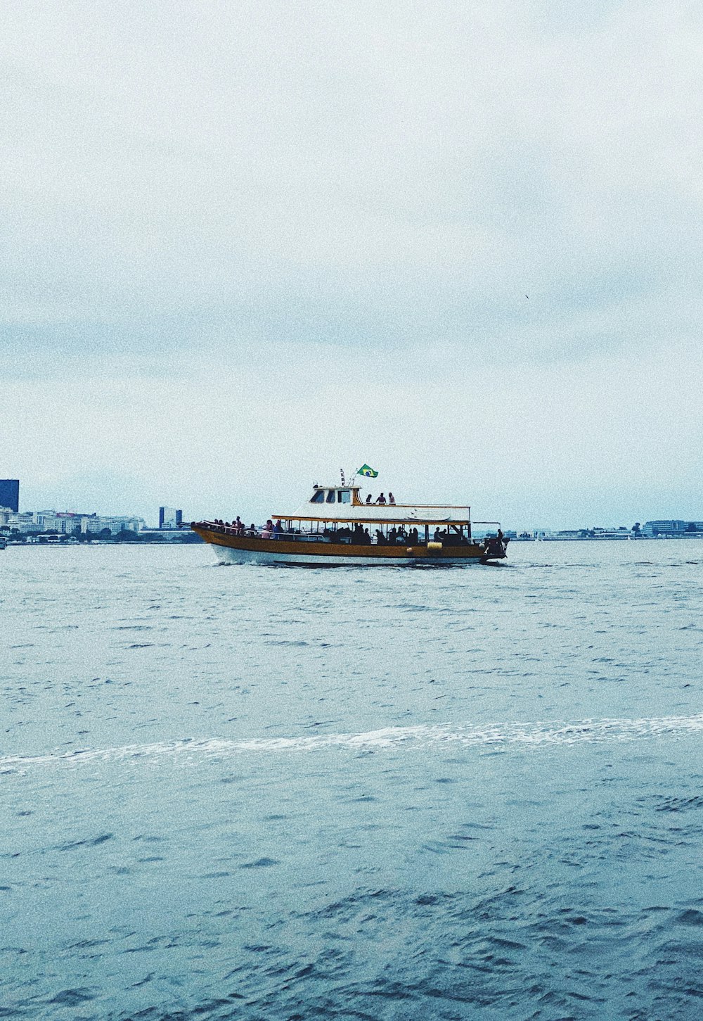 a boat with people on it in the water