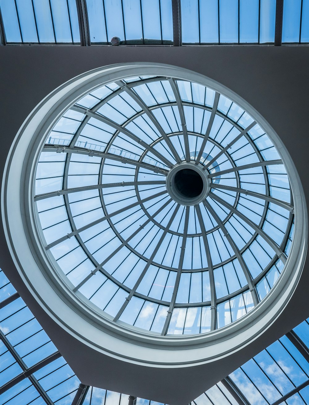 a circular glass ceiling in a building