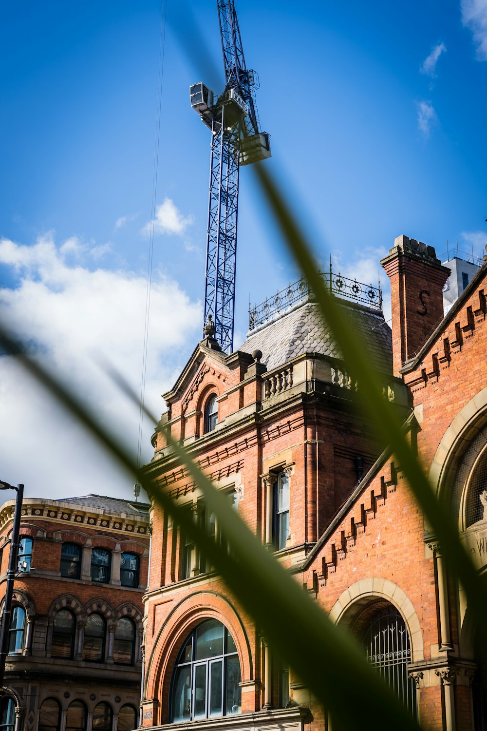 a large building with a crane on top of it