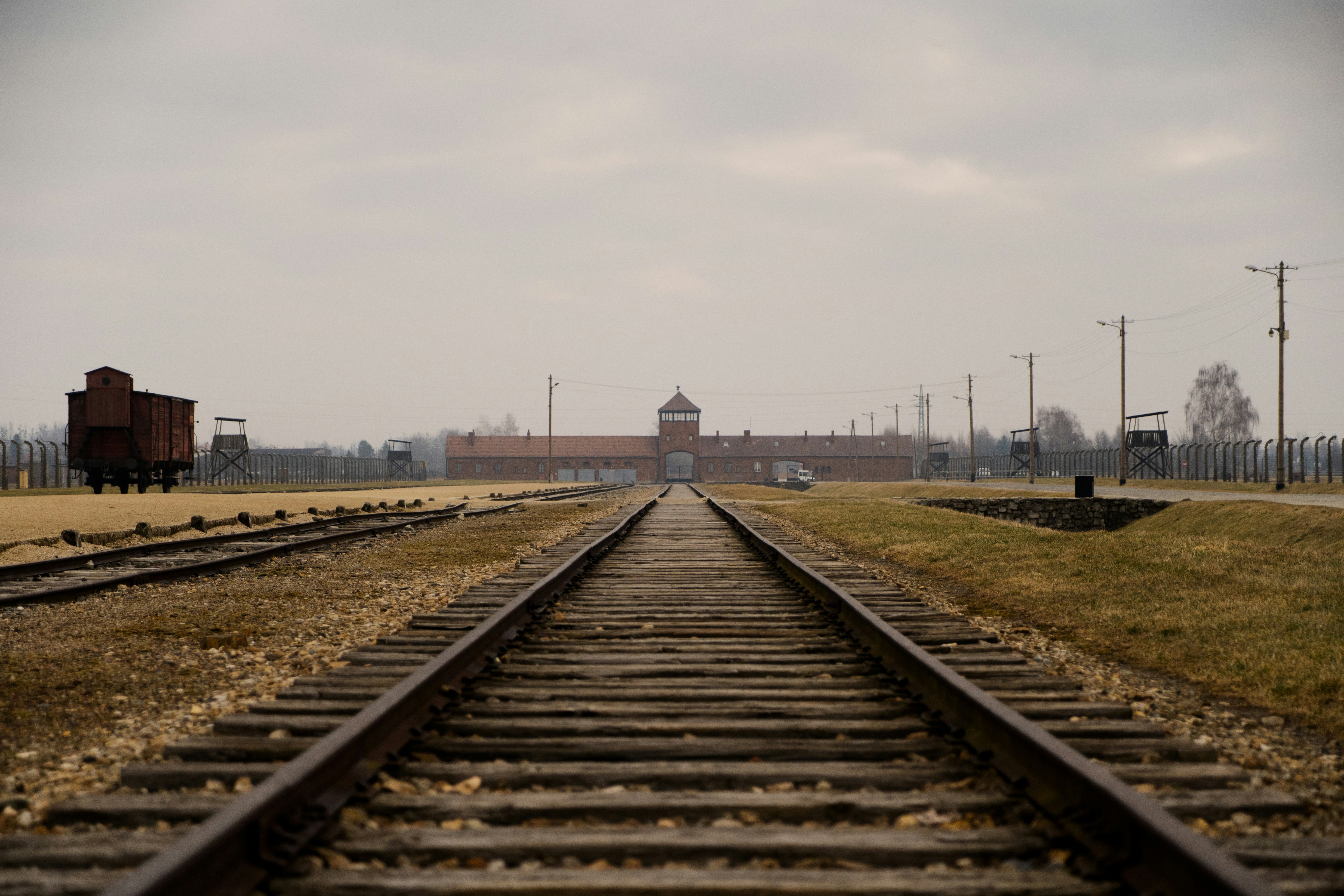 a train track with a building in the background
