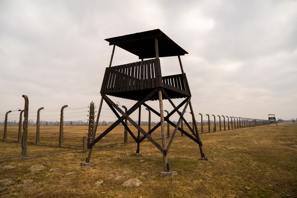 a guard tower in the middle of a field