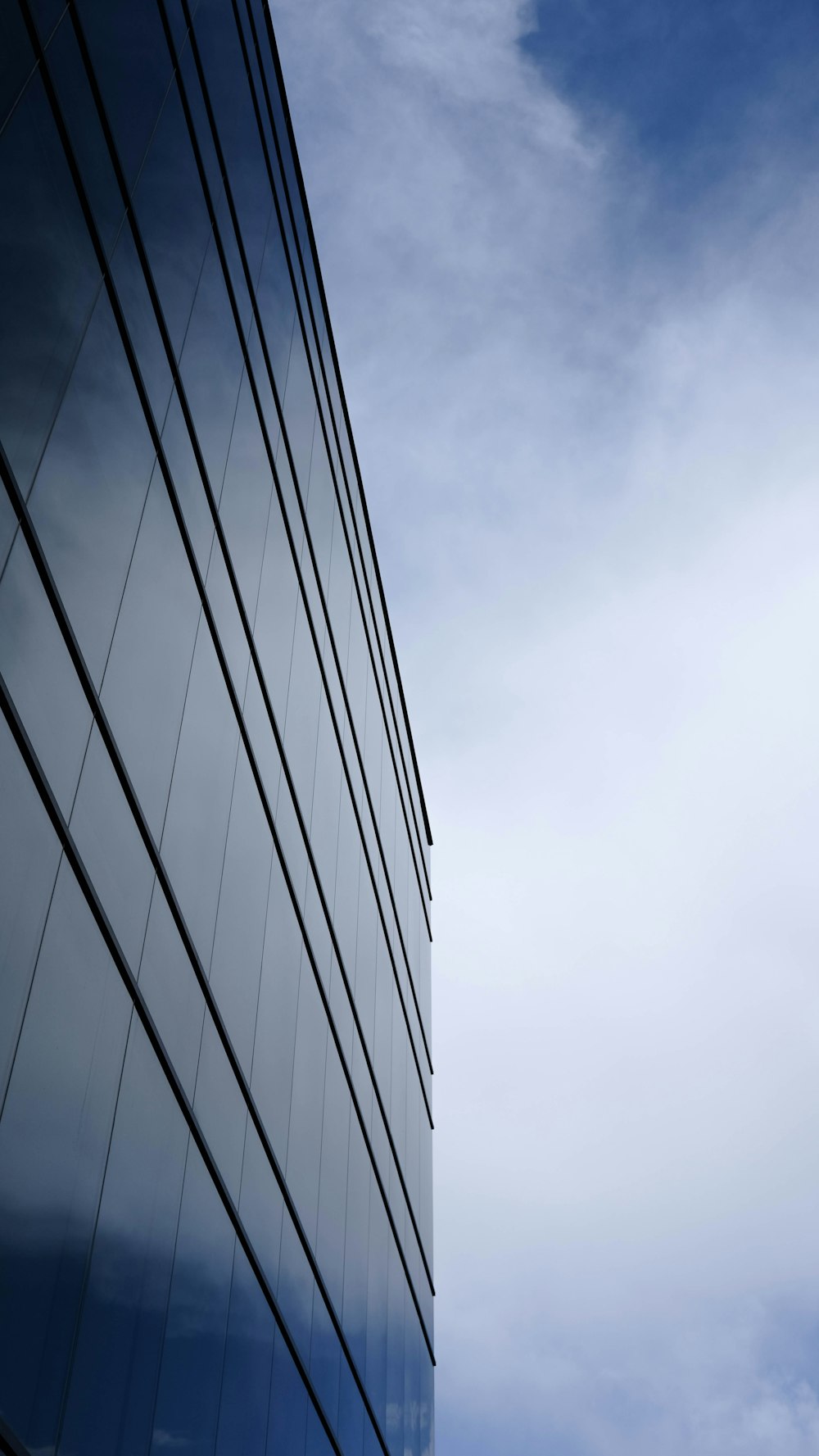 a tall building with a sky in the background