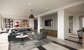 a living room filled with furniture and a flat screen tv