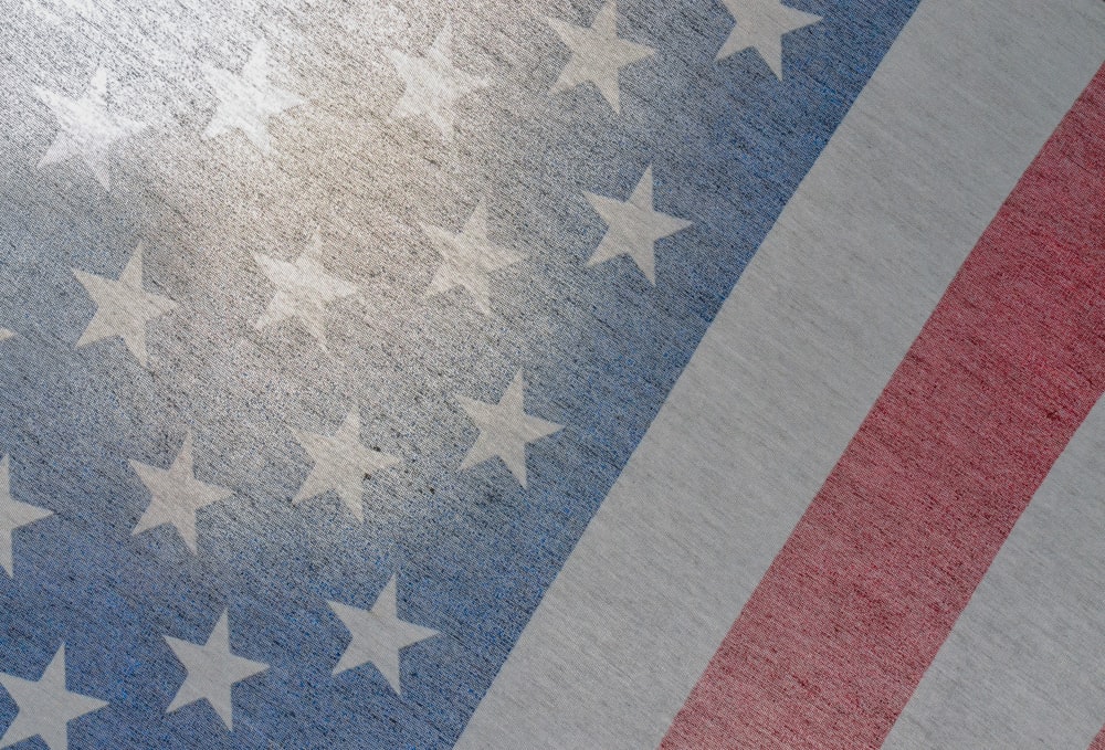 a close up of an american flag with stars on it