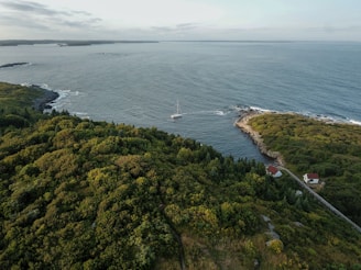 an aerial view of a small island in the middle of the ocean