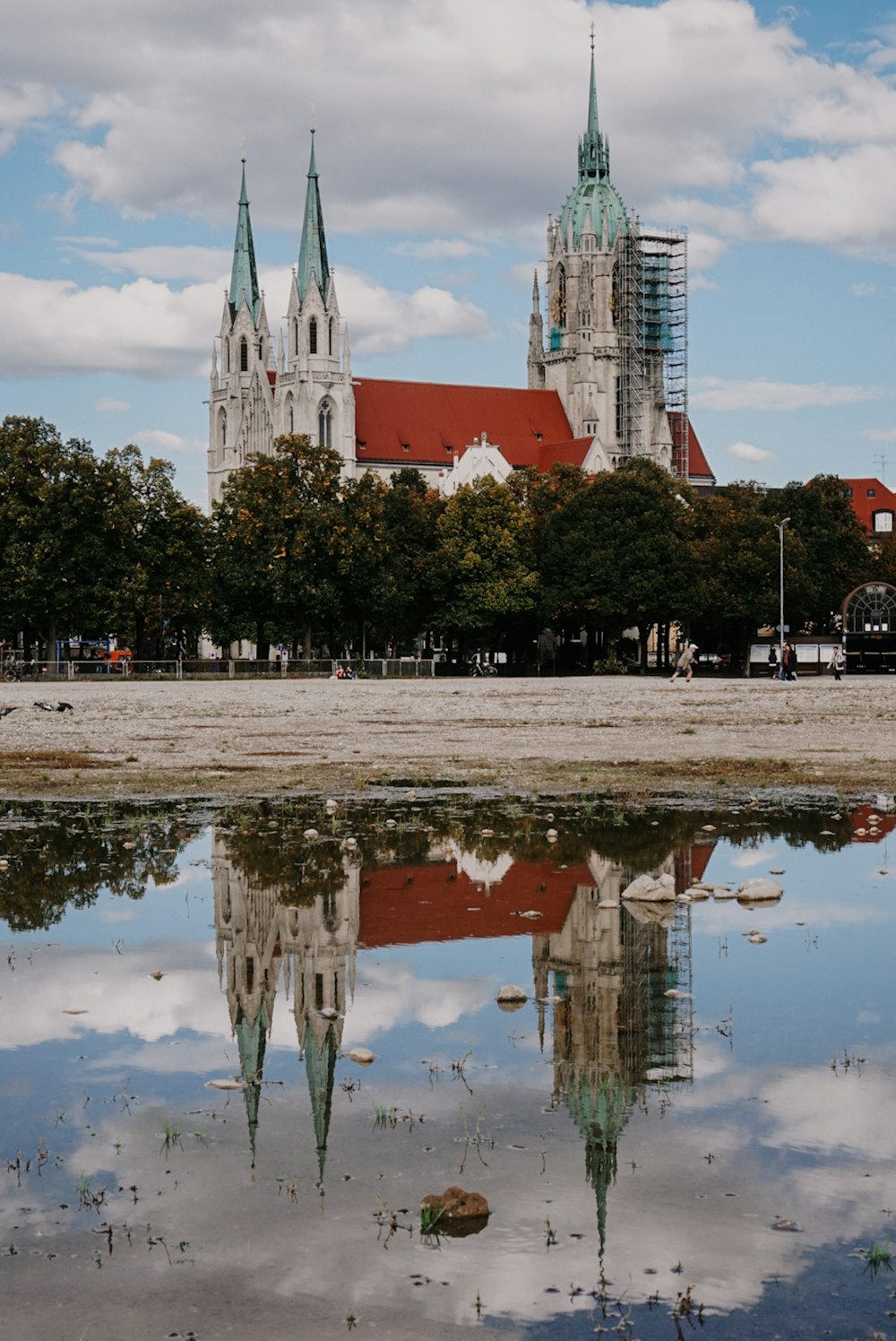 a large cathedral with a red roof and spires