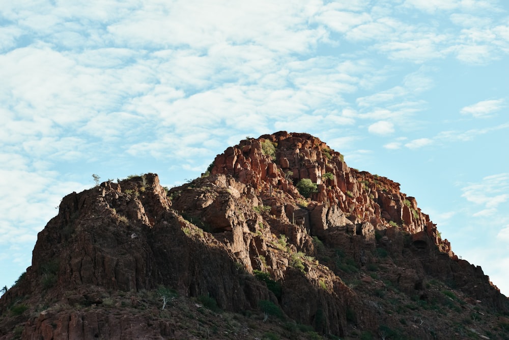 a very tall mountain with a sky background