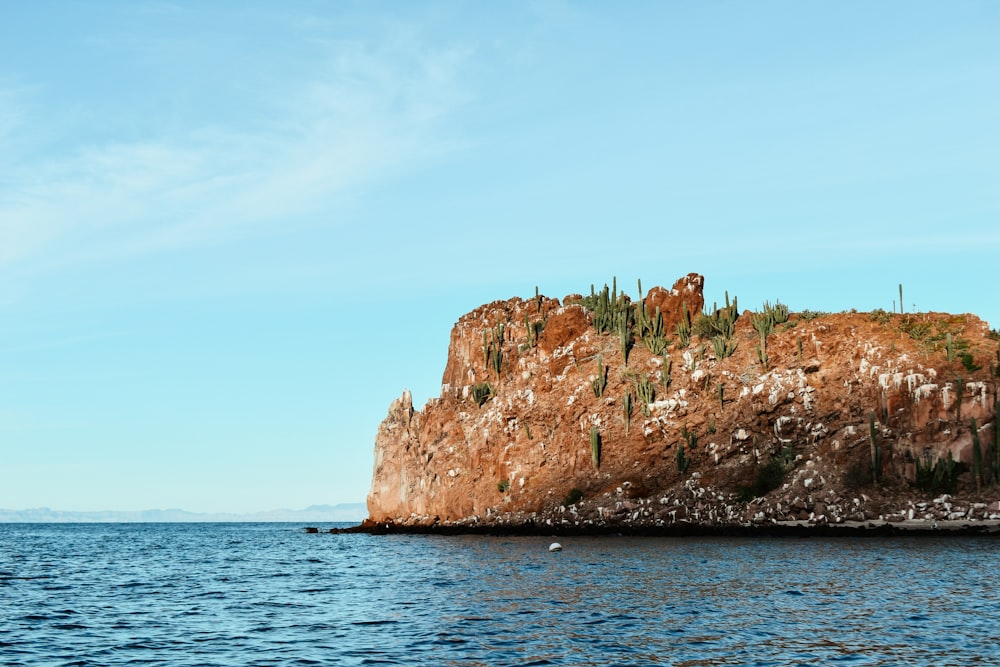 a rock outcropping in the middle of the ocean