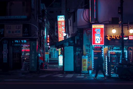 A stylish street scene in Seoul showcasing vibrant fashion trends under soft afternoon light.