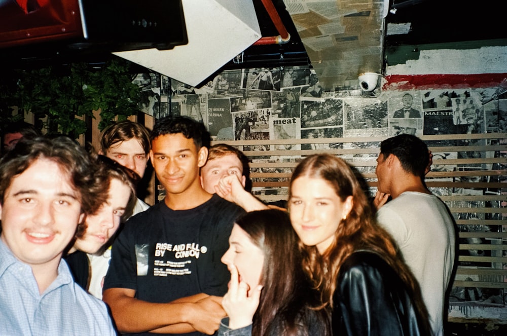 a group of young people standing next to each other