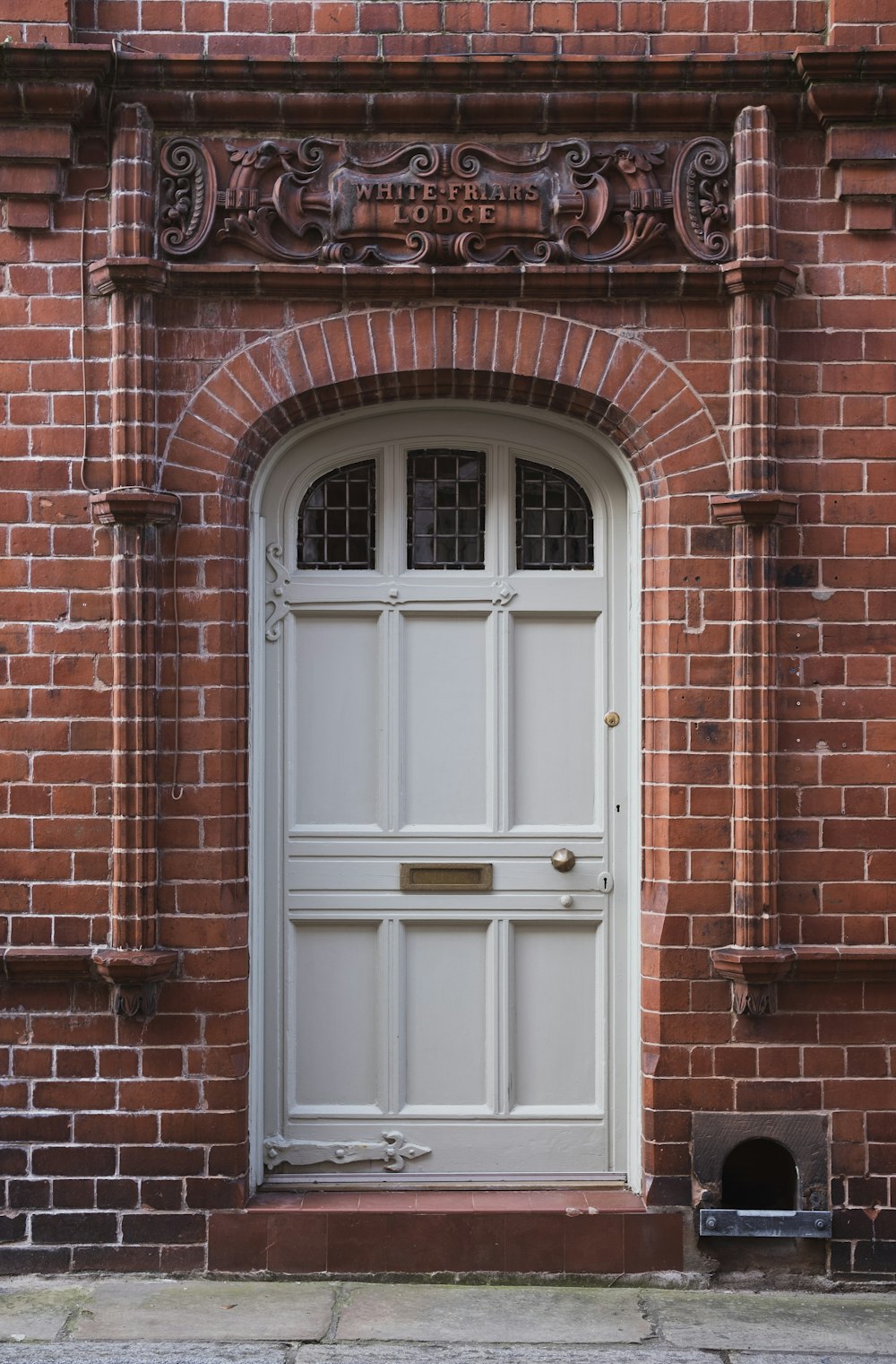 a brick building with a large white door
