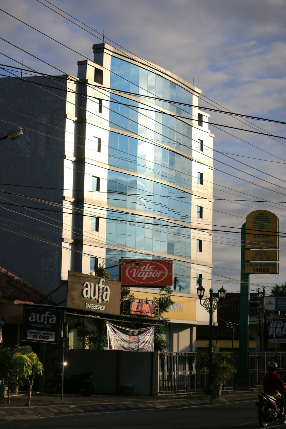 a tall building sitting next to a street