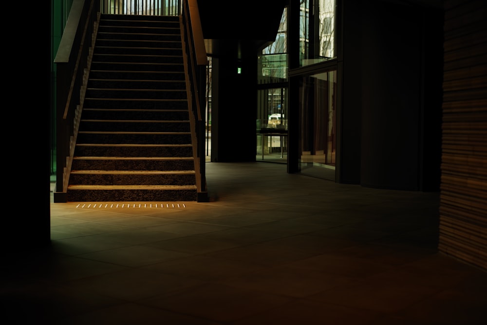 a dark hallway with a set of stairs