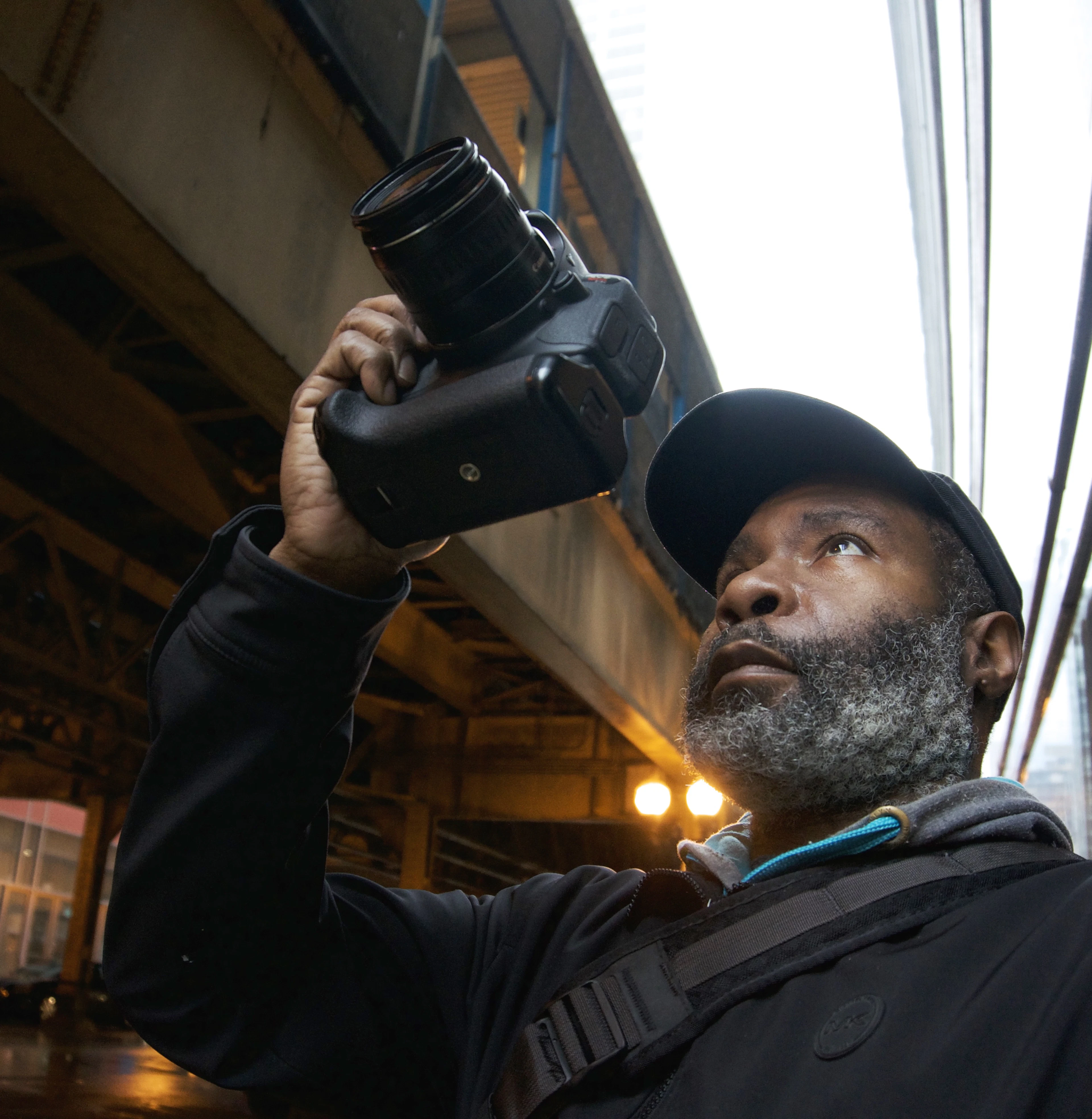 Photographer raising a camera