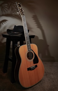 a wooden guitar sitting on top of a table