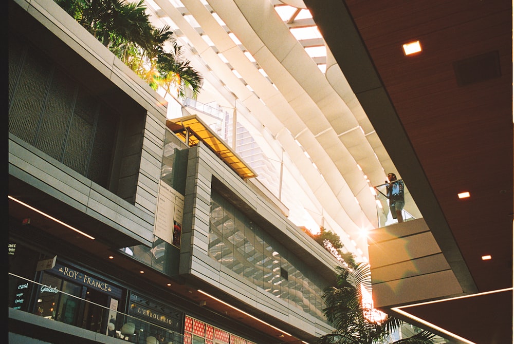 a man standing on a balcony of a building