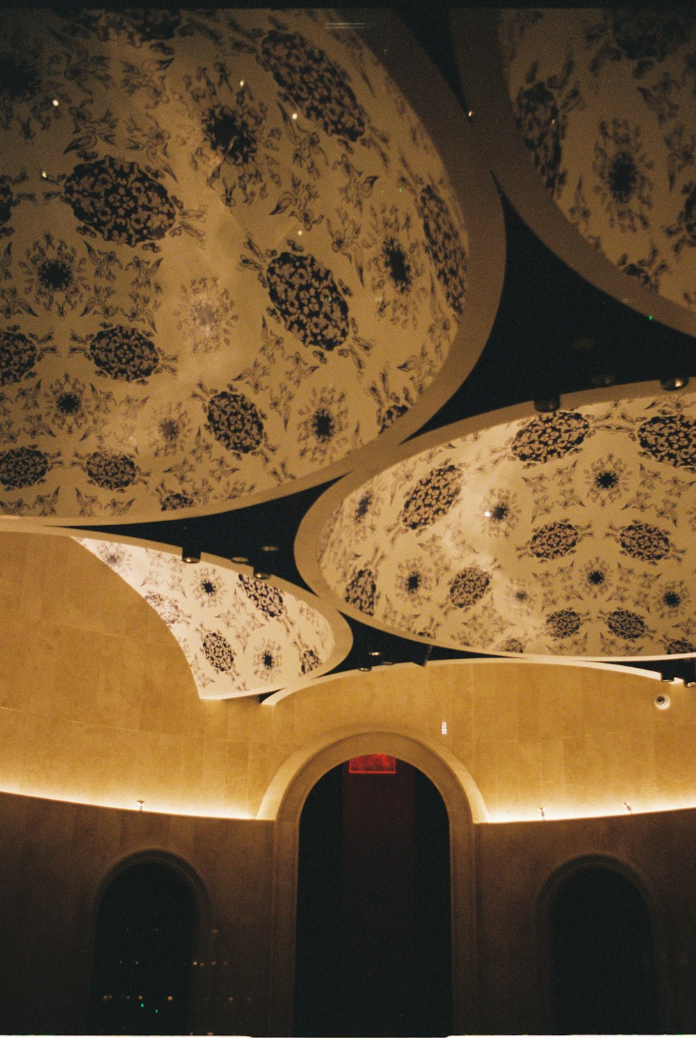 the ceiling of a building is decorated with intricate designs