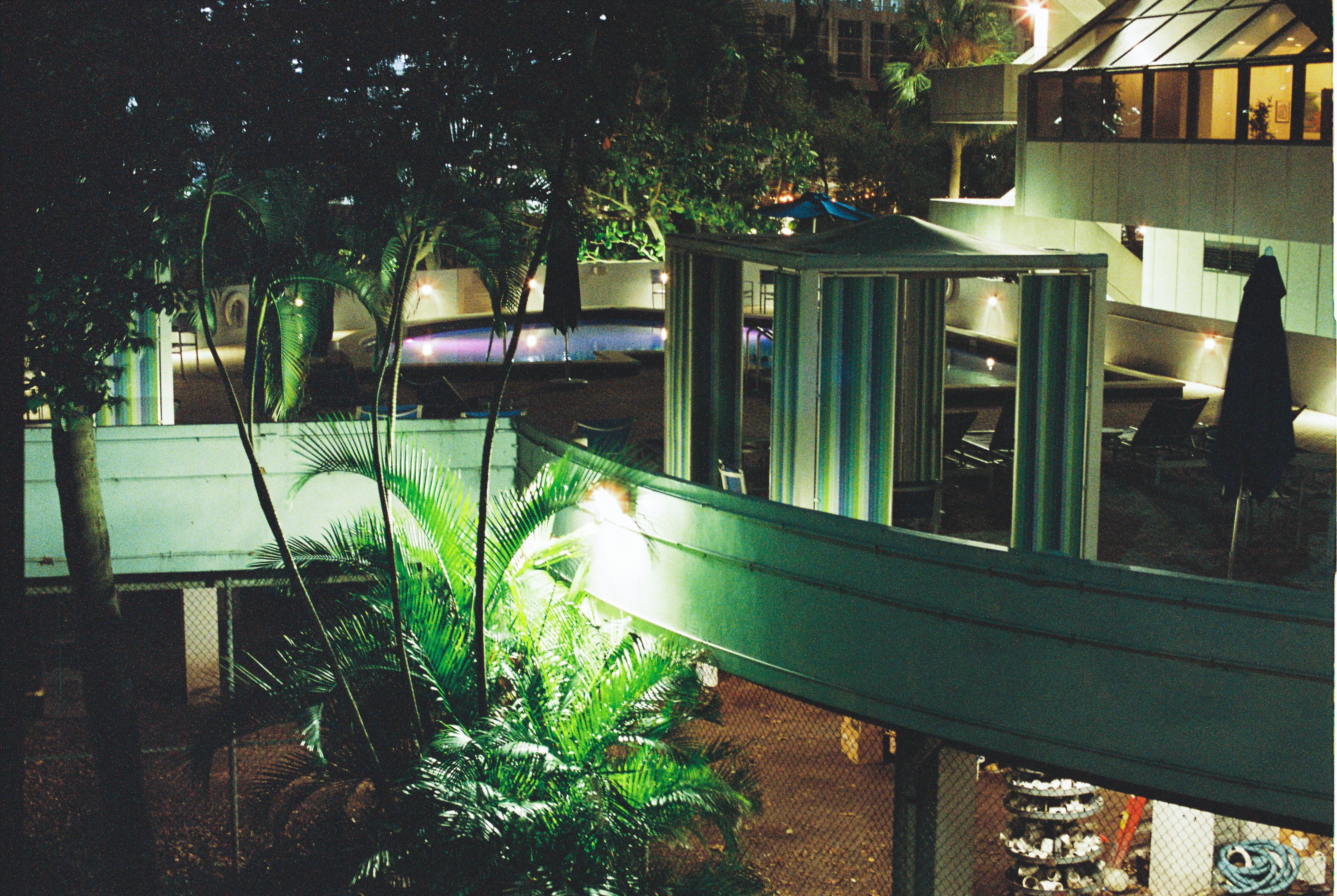 a view of a building at night from a balcony